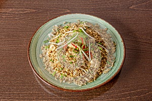 chaufa rice with vegetables, bean sprouts, chicken and pieces of fried egg photo