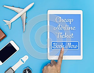 Cheap Airline ticket click button on tablet