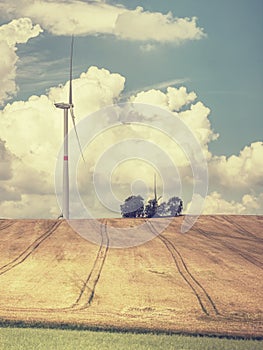 Cheap energy. Wind energy turbines in field with blue sky