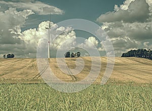 Cheap energy. Wind energy turbines in field with blue sky