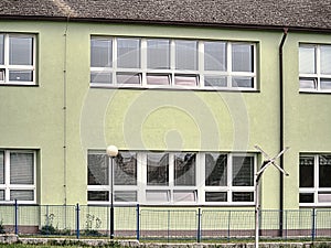 Cheap flats windows in  etage house in small town. Low cost photo