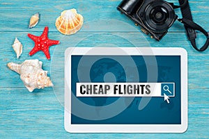 Cheap flights searching, website page opened in digital tablet l