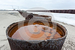 A cheapening barrel of oil, a rusty oil barrel photo
