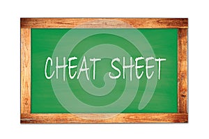 CHEAT  SHEET text written on green school board