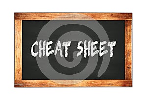 CHEAT  SHEET text written on wooden frame school blackboard