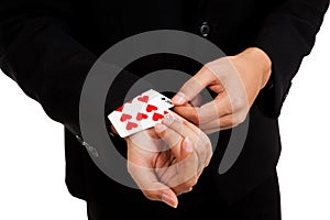 Cheating asian businessman pull playing cards from sleeve