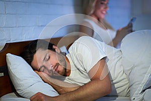 Cheating Girlfriend Chatting On Phone While Boyfriend Sleeping In Bedroom