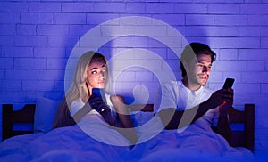 Cheating Husband Chatting On Cellphone Lying With Wife In Bed