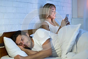 Cheating Wife Chatting On Cellphone While Husband Sleeping In Bedroom