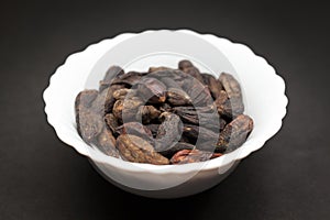 Chebulic Myrobalan (Terminalia chebula) in ceramic bowl.