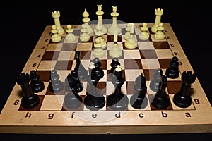 Chechered board with black pawns as a strategy backdrop