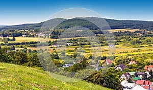 Panoramic view of town Checiny in Swietokrzyskie Mountains seen from Royal Castle medieval fortress hill near Kielce in Poland