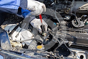 Check engine ignition system and change ignition coil. Car care service..Replacing ignition coil and spark plugs..Car mechanic