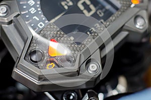 Check engine malfunction light on motorcycle dashboard