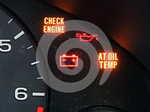 Check engine and other warning signage on car dashboard