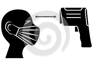 Check human body temperature using non-contact infrared thermometer. Temperature checks station or checkpoint. Mask on the face.