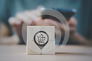 Check in icon with shopping cart inside on wooden cube blocks with woman, buyer persona and target customer concept. Personalized