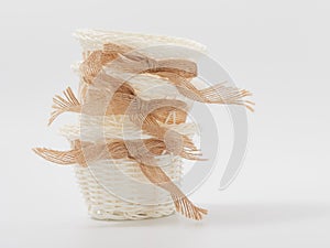 Check miniature baskets of vines on a white background