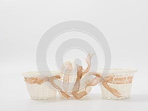 Check miniature baskets of vines on a white background