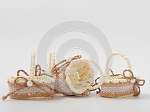 Check miniature baskets of vines on a white background