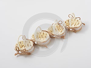 Check miniature baskets of vines on a white background