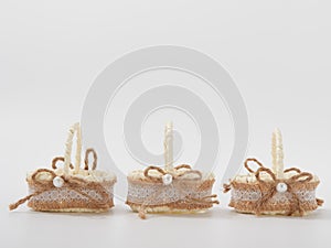 Check miniature baskets of vines on a white background