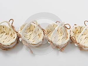 Check miniature baskets of vines on a white background