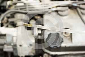 Check the oil level of the car against the engine