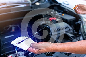 Check the oil level in car engine. Mechanic checking car engine or vehicle. Check and maintenance car with yourself