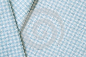 Blue check pattern fabric fold background