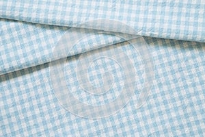 Blue check pattern fabric fold background