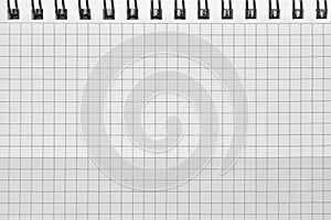 Checked spiral notebook background pattern, horizontal chequered squared open notepad copy space, stapled blank empty blocknote