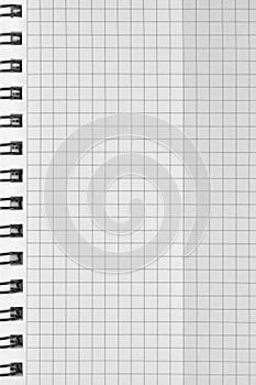 Checked spiral notebook background pattern, vertical chequered squared open notepad copy space, stapled blank empty blocknote