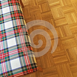 Checked textile banquette on parquet floor photo