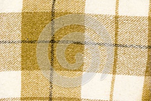 Checked wool fabric textured background. Cloth texture closeup