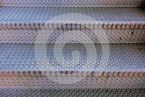 Checkerplate metal stairs; background pattern photo
