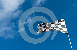 Checkered or chequered flag used in Motorsport.