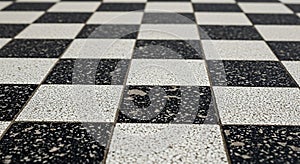 A checkered floor pattern composed of alternating black and white tiles. The tiles