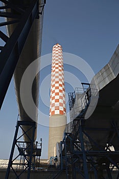 Checkered Smokestack Of Power Station