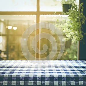 Checkered tablecloth texture top on blur of window background