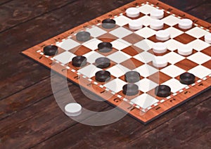 Checkers game. Checkerboard on a wooden table. Board games concept. Blurred background