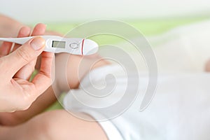 Checking baby temperature