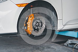 Checking car brake system for repair at car garage