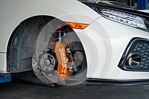 Checking car brake system for repair at car garage