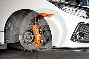 Checking car brake system for repair at car garage