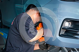 Checking car brake system for repair at car garage