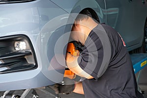 Checking car brake system for repair at car garage