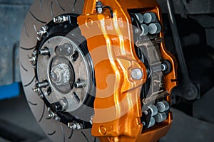 Checking car brake system for repair at car garage