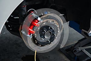 Checking car brake system for repair at car garage