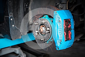 Checking car brake system for repair at car garage